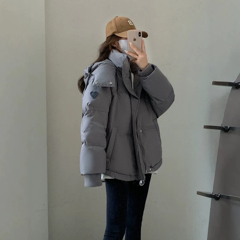 Damen nan oversized gesteppte Kurzjacke mit Kapuze, winddichter Fütterung und übergroßem Kragen Nord Taschen