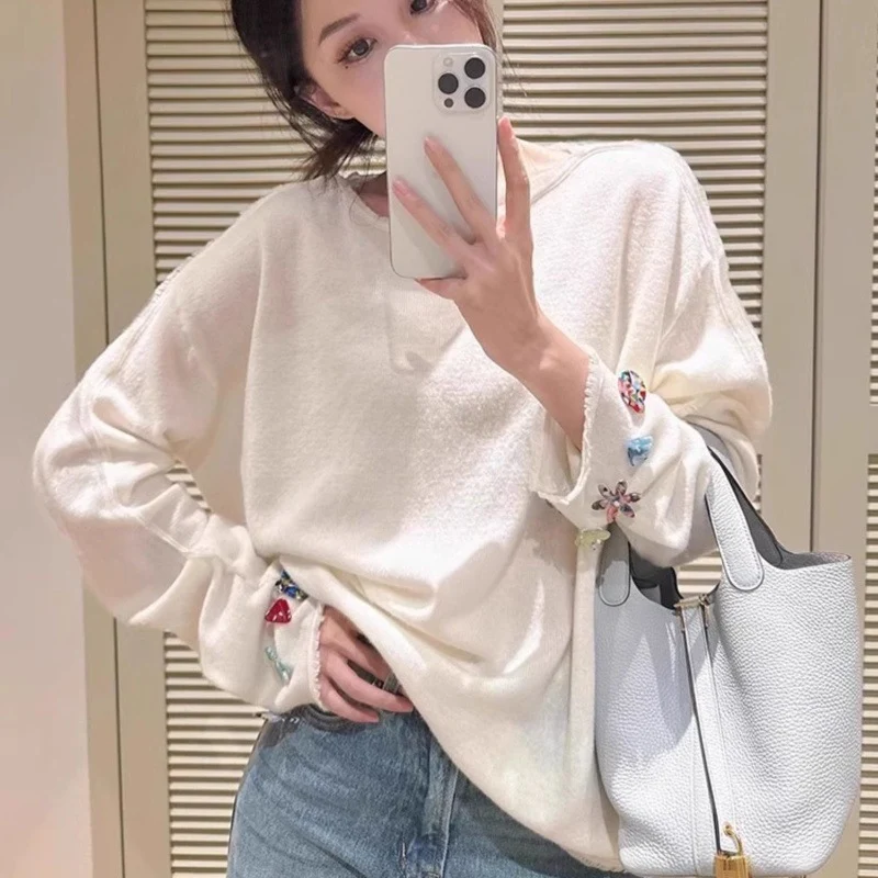 Damen Oversize-Feinstrickpullover mit schmuckbesetzten Ärmelabschlüssen Nord Taschen