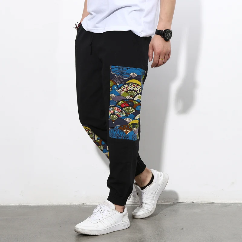 Herren Jogginghose mit seitlichen Panel-Prints, Tunnelzug und gerippten Bündchen Nord Taschen
