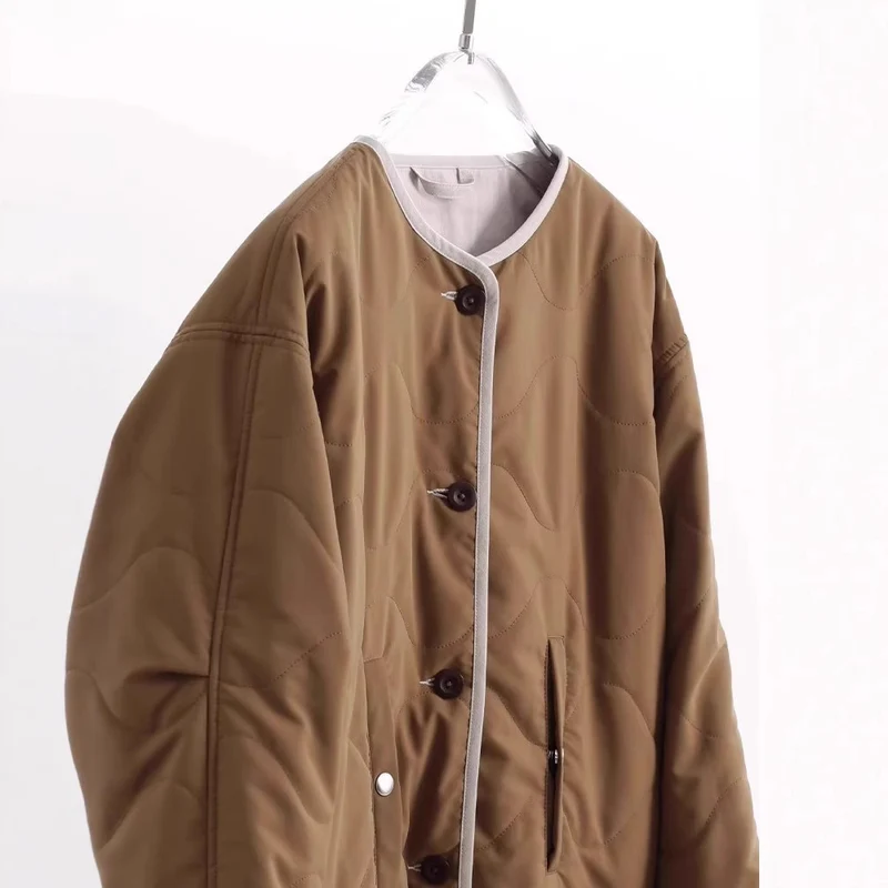 Damen Steppjacke ohne Kragen mit Oversize‑Silhouette und Kontrastpaspel Nord Taschen
