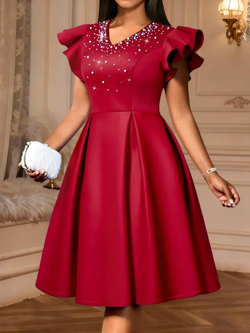 Damen A-Linien Kleid mit glitzernden Perlen und voluminösen Ärmeln