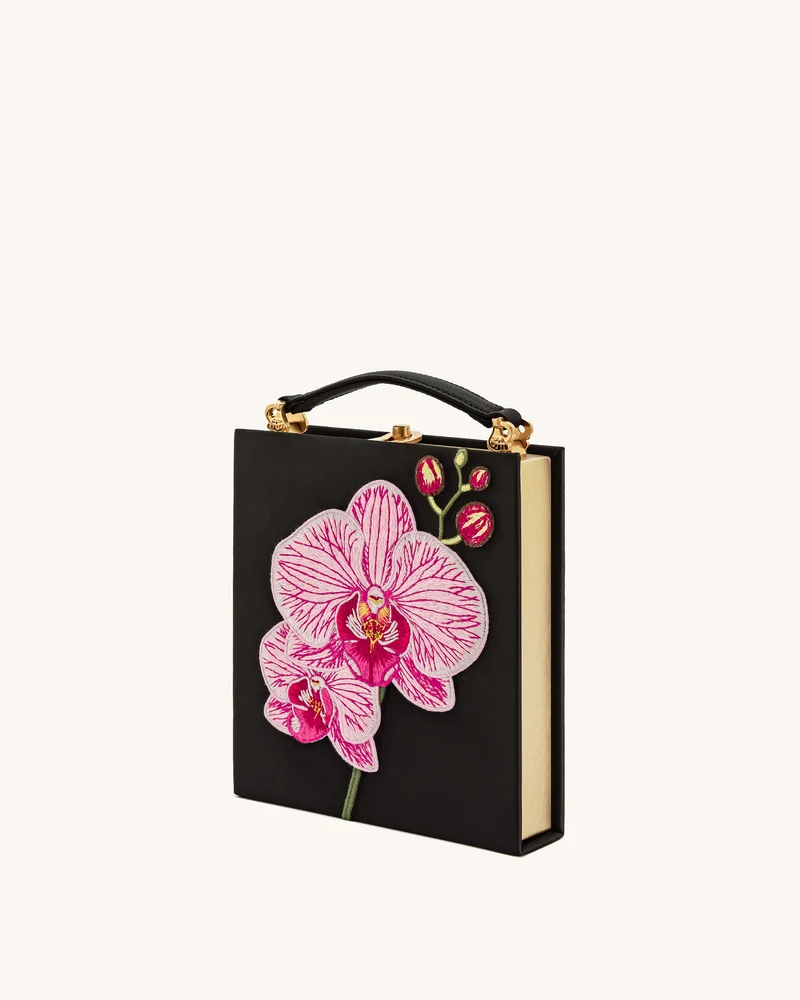 Taya Clutch in Buchform mit Orchideenmotiv – Schwarz