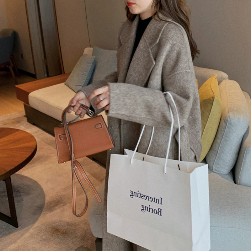 Damen Elegante und lässige Oversized-Wolljacke Nord Taschen