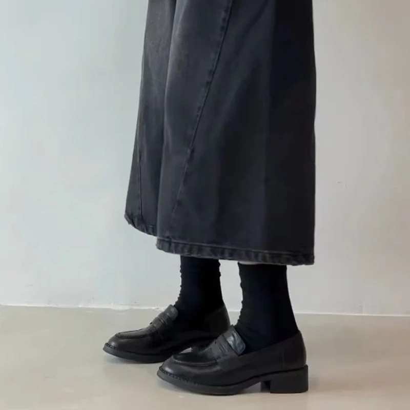Damen Leder-Penny‑Loafer mit gesteppter Kappnaht und niedrigem Blockabsatz Nord Taschen