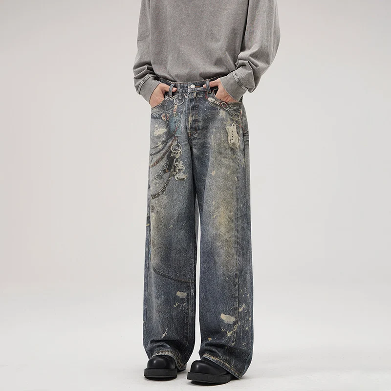 Herren Weit geschnittene Stonewashed-Denim-Jeans mit Kettenprint, Farb‑Splatter und bodenlangem Saum Nord Taschen