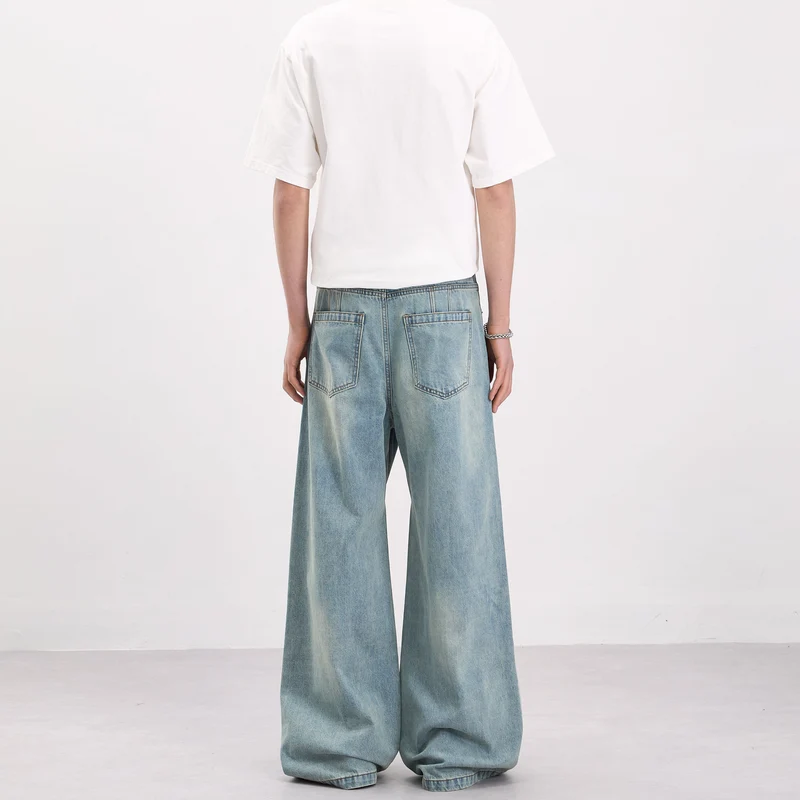 Herren Weit geschnittene Denim-Palazzohose mit geschwungenen Nahtpaneelen und extralangem Saum Nord Taschen