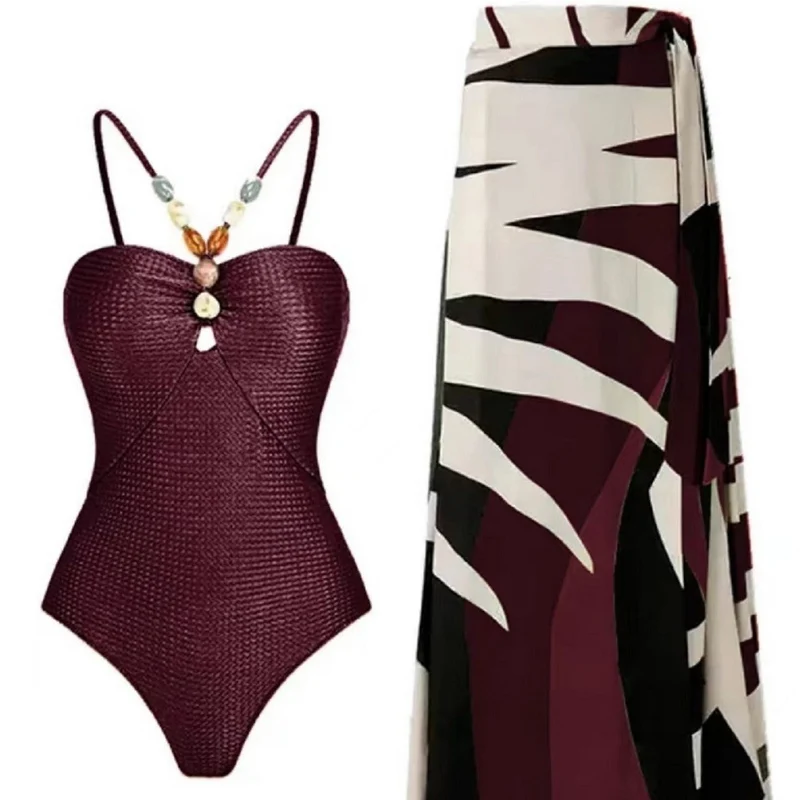 Damen Badeanzug mit elegantem Wickelrock und modischen Schmuckdetails